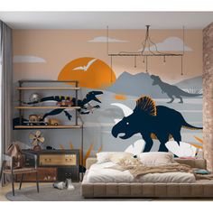 a bedroom with dinosaurs painted on the wall