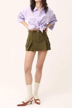 Micro-mini skirt look with lining shorts underneath Faux pocket on the sides Product Specification 97% Cotton 3% Spandex Flat measurement (XS/S) Waist 34cm / hip 43cm / length 35cm (S/M) waist 35.5cm / hip 41cm / length 33cm Professional Clean Only / Do Not Tumble Dry Model's height is 6' 8" (175cm) Bust 31in Waist 23in Hip 34in and wearing XS/S Made in Korea Green Mini Skirt With Built-in Shorts, Casual Skirt With Built-in Shorts For Work, Trendy Mini Bottoms With Pockets, Mini Skirt With Cargo Pockets For Summer, Cotton Mini Skort With Cargo Pockets, Summer Mini Skirt With Cargo Pockets, Spring Stretch Mini Cargo Skirt, Chic Mini Skirt With Side Pockets, Mini Cotton Skort With Cargo Pockets