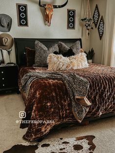 a bed room with a neatly made bed and animal prints