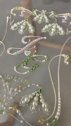 several different types of beaded and sequins on a piece of glass cloth