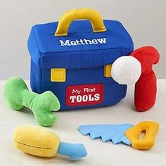 the toys are all in different colors and sizes, including a toolbox with handles