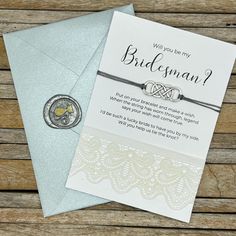 a bridesmaid card with a wax seal on it next to an envelope that says will you be my bridesmaid?