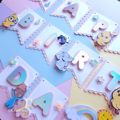 the letters and numbers are decorated with cartoon characters