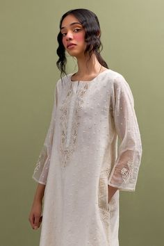 Ivory kurta with thread embroidery and organza patch on the sleeves. Paired with embroidered hem pant. - Aza Fashions Elegant Cutdana Kurta For Summer, Elegant Cutwork Kurta For Spring, Elegant Spring Kurta With Cutwork, Elegant White Kurta With Cutwork, Festive Cream Kurta With Cutwork, Elegant White Cutwork Kurta, Traditional Cream Kurta With Cutwork, Festive Off White Cutwork Set, Festive Off White Sets With Cutwork