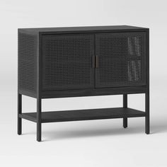 the sideboard is made from black wood and has an open door on one side