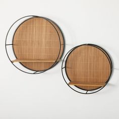 two circular metal shelves with wooden shelves on them