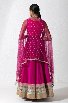 Hot pink lehenga with mirror work, gota patti, zari hand embroidery on the border. Comes with zardozi embroidered V neck blouse and pearl and sequin embroidered dupatta.
Components: 3
Pattern: Embroidered
Type Of Work: Mirror, Gota Patti, Zari, Zardozi and Sequin
Neckline: V neck
Sleeve Type: Sleeveless
Fabric: Taffeta, Raw Silk and Net
Color: Pink
Other Details: 
Sheer dupatta with sequin and pearl embroidery on the border
Blouse with curved hem
Closure:
Blouse: Side zip
Lehenga: Side zip and h Lehenga With Mirror Work, Hot Pink Lehenga, Sheer Dupatta, Pearl Embroidery, Pink Lehenga, Embroidered Lehenga, Pink Mirror, Embroidered Dupatta, Fashion App