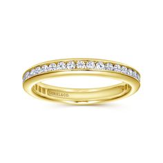 a yellow gold wedding band with channeled diamonds