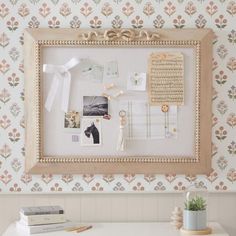 a white desk topped with a framed photo