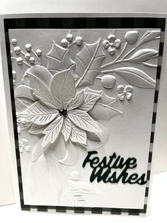 a close up of a greeting card with white flowers and leaves on the bottom corner