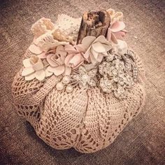 an old purse with flowers and pearls on the inside is sitting on a carpeted floor