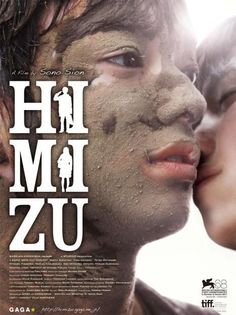 a movie poster with two people covered in mud and the words hi mom zu on it