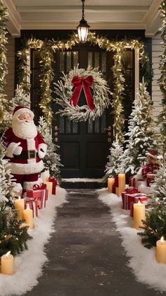 a christmas scene with candles and decorations on the front door, santa clause standing outside