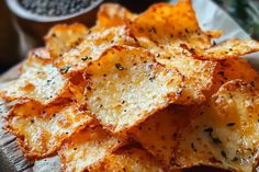 a pile of baked potato chips sitting on top of a table