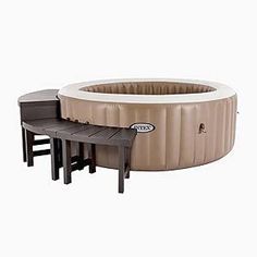 an inflatable hot tub with two stools next to it on a white background