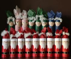 a group of santa clauss sitting next to each other on top of a table