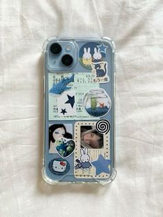 an iphone case with some pictures on it and other things in the back ground as well