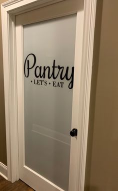 a pantry door with the words pantry let's eat written on it in black