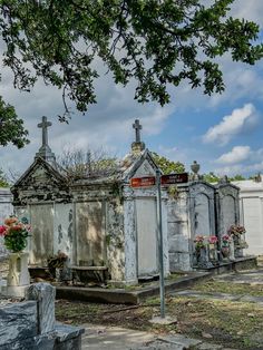 an old cemetery with many graves and flowers