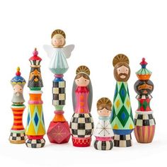 a group of wooden figurines sitting next to each other