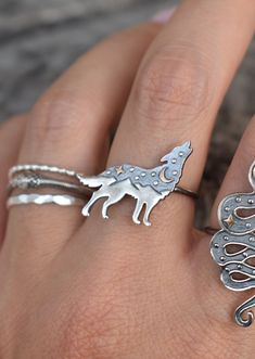 Moon & Star Wolf Ring details:-Solid .925 sterling silver-Bronze Gold Moon and Star-Wolf measures approx. 20mm x 17mm-Smooth ring band measures 1.2mm wide-Comfortable and easily stackable!-Available in US sizes 1-11 with half sizes. Connect with us on Instagram @a_wild_violet for sales and giveaways!**All items are in stock and ship within 2-5 business days from received payment (excluding Saturday/Sunday) from the US. If you are within the US please expect 3-7 business days for shipping transit Adjustable Silver Magical Style Rings, Magical Silver Moon Jewelry, Magical Silver Open Ring Jewelry, Unique Silver Moon-shaped Ring, Mystical Sterling Silver Nickel-free Rings, Nickel Free Mystical Sterling Silver Ring, Mystical Nickel-free Sterling Silver Rings, Nickel-free Mystical Sterling Silver Rings, Nickel Free Moon Shaped Sterling Silver Rings