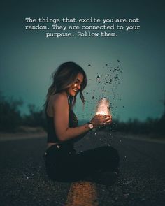 a woman sitting on the ground holding a jar with bubbles coming out of it and an inspirational quote above her