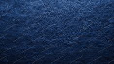 a dark blue textured background or wallpaper