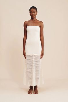 Our antique-inspired Romy Strapless Dress is crafted from the softest viscose blend in a crochet knit. Designed for a close fit, it features an elegant square neckline and floaty hem adorned with scalloped trims. The subtle cream hue makes it perfect for a memorable bridal moment. Tell Me More Antique inspired crochet knit Strapless style Elasticated bust Scallop edge hemline Over the head entry Strapless bra friendly Fit Notes LZ is 5'7", 120 lbs. & wears size XS Fits true to size, take your no Vacation Outfit Inspiration, Tell Me More, 120 Lbs, Scallop Edge, Dress Cream, Vacation Outfit, Antique Inspiration, Cream Dress, Strapless Bra