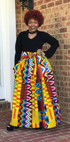 "What a beautiful garment!  You can wear this skirt for business, pleasure any anything in between.  Pair this skirt with a blouse, t-shirt, jean jacket or blazer for an attention grabbing look.  This skirt has an elastic waist band, pockets, sash and fits sizes 4-24.   Maxi Skirt - 43\" to 45\" Midi Skirt - 27\" to 29\" High Low Skirt - Back of the skirt will be a maximum of 45\" (customer to provide length of skirt front) One week prior to processing the order, an email will be sent to the customer for fabric selection. NOTE--- I have many prints to choose from and can make this style in a print of your choosing. Just convo me for print options.  The fabric shown on the model is for illustration purposes only." African Print Midi Skirt, Stil Rock, Skirt African Print, African Prom Dresses, African Print Skirt, African Skirts, Ankara Skirt, Maxi Rok, Purple Skirt