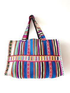 This bag was produced from the recycled handmade traditional fabric of the Andean highlands. Black lining inside with a pocket. Measurements:  Height: 12.5 inches (32 cm) Flat width: 19 inches (48 cm) Depth/Gusset: 6.5 inches (17 centimeters) Drop down strap length: 11 inches (28 cm) / Handle length: 25 inches (64 cm) Cotton Handwoven Bags For Everyday Use, Everyday Handwoven Cotton Bags, Large Woven Travel Bags, Handwoven Cotton Bags For Everyday Use, Woven Shoulder Satchel For Market, Large Handwoven Shoulder Bag For Travel, Large Handmade Bag, Traditional Tote Beach Bag For Everyday Use, Large Handwoven Bags For Market