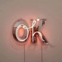 a neon sign with the word ok on it