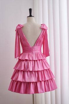 This Pink Plunge Tiered Ruffle Short Homecoming Dress features pink taffeta material, an A-line silhouette, and exquisite details such as bow straps, a ruched top, and a tiered ruffle skirt. The plunging neckline, zip-up back, and above knee length add to the overall elegance of this dress. Item #NP1096 Material: Taffeta Color: Pink Silhouette: A-line Embellishment: Bow straps, ruched tiop, tiered ruffle skirt Neck: Pluge Back: Zip-up back Length: Above knee length Fully lined: Yes Built-in bra: Yes True to size. Made in China. Dresses are usually packed inside out for protection. Hand wash Tiered Party Dress With Bow, Taffeta Prom Dress With Ruffles, Elegant Tiered Dress With Bow, Party Dresses With Bow Tie Back And Ruffled Straps, Pink Taffeta Dress With Ruffles, Pink Tiered Dress For Formal Occasions, Formal Pink Tiered Dress, Formal Tiered Pink Dress, Pink Dress With Tie Back And Ruffled Straps