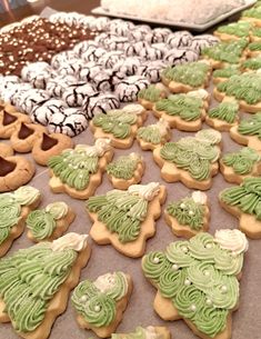 many decorated cookies sitting on top of a table