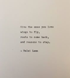 an old typewriter with the words give the ones you love wings to fly, roots to come back and reason to stay