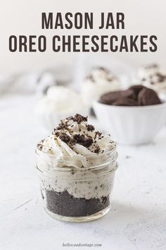 mason jar oreo cheesecakes in small glass jars on a white surface with text overlay