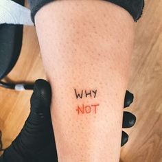 a person with the word why not written on their leg