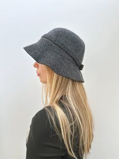 This item is HANDMADE -Material: 100% Wool-Size: 53-58cm (adjustable)Cute wool cloche hat with a variety of colours to choose! Carefully hand-knitted, this hat is made of a soft 100% wool that can keep you warm and comfortable in winter! This hat is foldable so it is easy to carry. There is string inside the hat so it is also adjustable. An ideal gift for her! Adjustable Wool Hat With Short Brim, Winter Wool Cloche Felt Hat, Winter Wool Cloche Hat, Adjustable Wool Brimmed Cloche Hat, Adjustable Brimmed Wool Cloche Hat, Wool Brimmed Cloche Hat For Winter, Winter Wool Brimmed Cloche Hat, Casual Wool Bucket Hat With Curved Brim, Casual Wool Cloche Hat For Winter