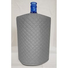 a large gray bottle with a blue lid