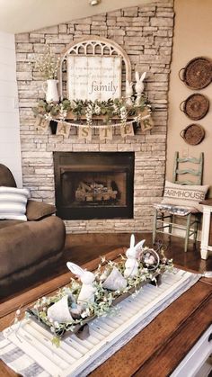 a living room filled with furniture and a fire place in front of a brick fireplace