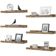 three wooden shelves with pictures and other items on them, one shelf has an alarm clock