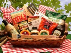 a picnic basket filled with food and condiments