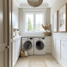 a washer and dryer in a white laundry room