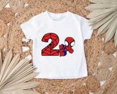 ♥ BEST PRICE ON ETSY, LOWEST PRICES ON ALL OF OUR PRODUCTS ♥  **BRAND NEW PERSONALIZED SHOP**  ♥Awesome shirt personalized with name and age number for your little SUPER MAN fan! This listing is for a custom printed t-shirt. You can chose to add name or only the number **Great quality and handmade with much love. ♥ If you have any questions, please message me. ♥ Processing time is 1-3 days, so you will have your item super fast and you will love it! :) Superhero Graphic Print Tops For Birthday, White Superhero Character Print Tops, White Superhero Graphic Print Tops, Third Spiderman Birthday Shirt, Spider Man Birthday Shirt Vinyl, Spider Man Family Birthday Shirts, Spiderman 5th Birthday Shirt, Superhero Style Short Sleeve T-shirt For Birthdays, Superhero Style Short Sleeve T-shirt For Birthday