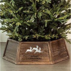 a small christmas tree in a wooden box