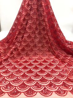 We offer a variety of fashion handmade fabric，those are widely use for wedding dress，garment and fashion cloth. we sell it by yard，our minimum order is 1 yards，and we always package it 15 yards for one roll，the width is about 125cm/45inch Material ： sequins ,beads ,mesh ，Rayon,polyester. Symmetrical embroidery floral pattern, with lovely flowers in the middle, scalloped border. You can also cut and use separately. Perfect for dress, tops, wedding veil. You can split the piece up and have one sca Red Embroidered Lace Fabric For Party, Red Lace Embroidered Fabric With Sequins, Red Sequined Lace Embroidered Fabric, Red Embroidered Sequin Lace Fabric, Fitted Red Lace For Party, Pink Crochet Lace For Party, Crochet Lace Tulle Fabric For Party, Party Lace Embroidered Fabric And Notions, Party Lace Fabric With Embroidery