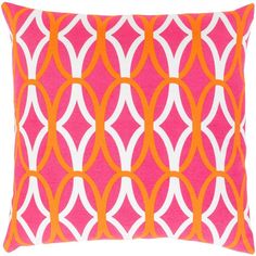 a pink and orange pillow with white circles on it