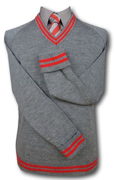 A top quality mid grey 'V' neck jersey with fold back cuffs. Red trim at the neck line, cuffs and welt. Available in sizes from 36" to 48". 100% man made fibres. Fully machine washable. Medium weight and will keep you nice and warm. British made. A range of matching accessories are also available. Fitted Gray Sweater With Ribbed Cuffs, Fitted Red Tops With Ribbed Cuffs, Grey School Shorts, Grey Uniform, Woolen Socks, School Shorts, Neck Line, Matching Accessories, Red And Grey