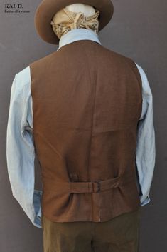 Made in soft striped cotton in dark brown color. Back panel in Belgian linen in officer olive color. Fully lined in soft cotton. Dark brown corozo buttons. We have revamped the vest of our waistcoat to be less slim. Slightly lower the armhole for more comfort. Chest pocket deeper for most phones, eyeglass case (leather eyeglass case not included). Two lower pockets plus one pocket for wrist watch. One big inside pocket. Size S: chest 38" Size M: chest 40" Size L: chest 42" Size XL: chest 44" Siz Classic Brown Vest With Buttons, Classic Brown Vest With Pockets, Fitted Cotton Nehru Jacket With Pockets, Brown Workwear Vest With Buttons, Brown Linen Outerwear With Buttons, Tailored Brown Vest With Buttons, Tailored Brown Vest With Pockets, Classic Brown Cotton Vest, Brown Cotton Vest With Buttons