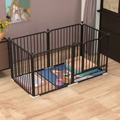 a black metal baby crib in the corner of a room