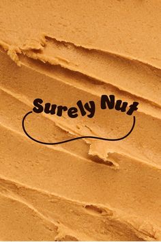 the word surely nut is written in black ink on a brown background with an orange swirl